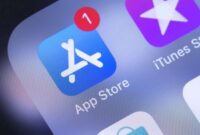 Apple iPhone with AppStore, iTunes, Music, Podcasts, Apple Store icons on the screen. Apple Inc. is an American multinational technology company. Moscow, Russia - October 14, 2018