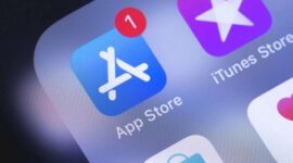 Apple iPhone with AppStore, iTunes, Music, Podcasts, Apple Store icons on the screen. Apple Inc. is an American multinational technology company. Moscow, Russia - October 14, 2018